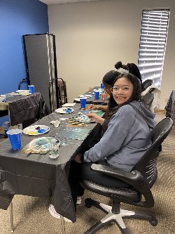 Smiling student at paint night